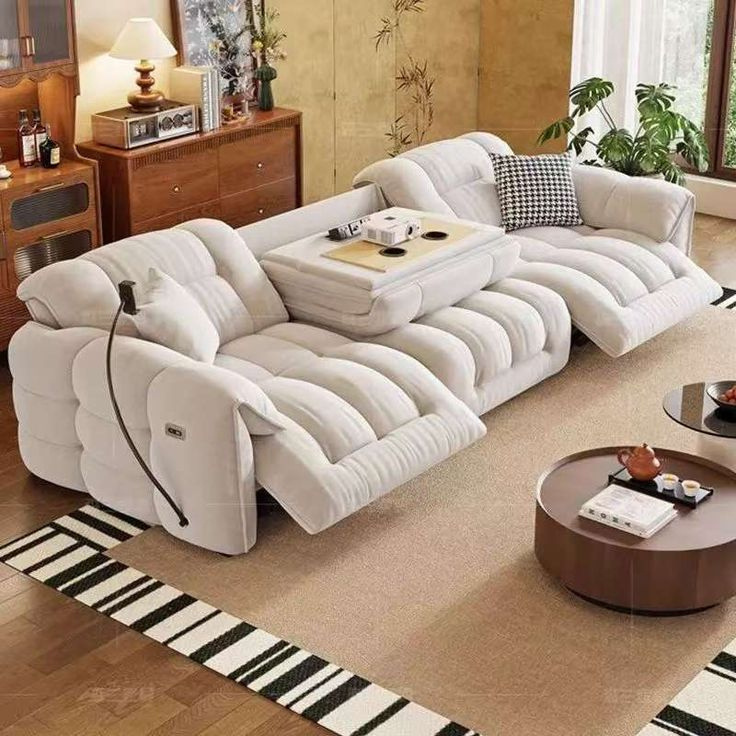 A plush cream L-shape sofa in a softly lit living room